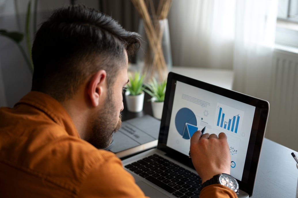 Man on laptop building a strong cash flow strategy for his eCommerce business