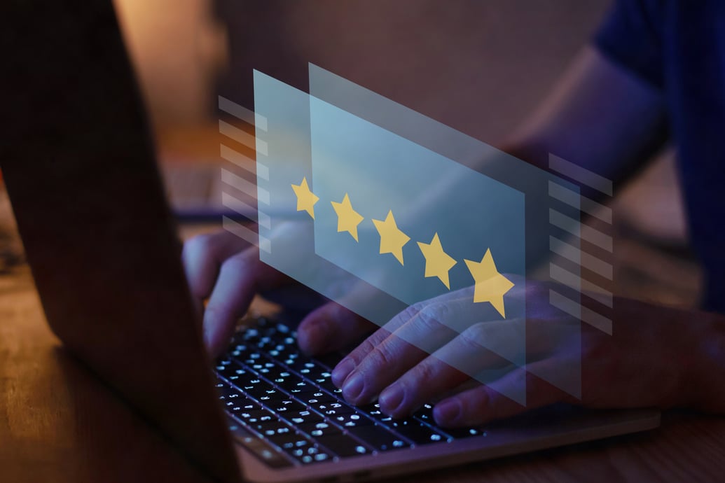 Person reviewing a business five stars.