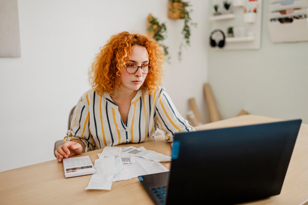 Female eCommerce business owner monitoring growing costs due to inflation